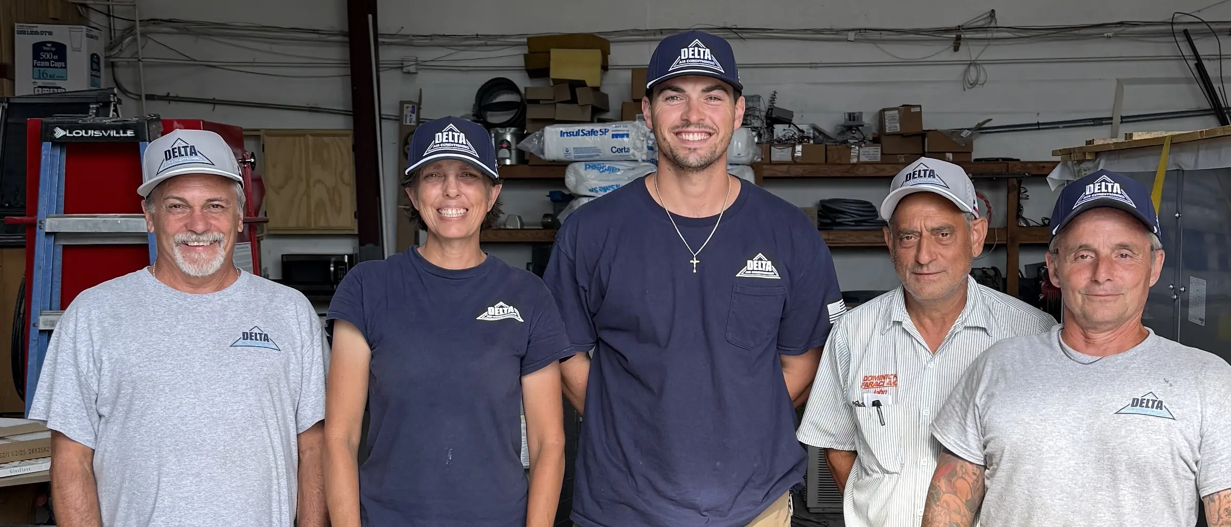 The Delta Air Conditioning crew wearing their custom embroidered Reel48 caps in the shop