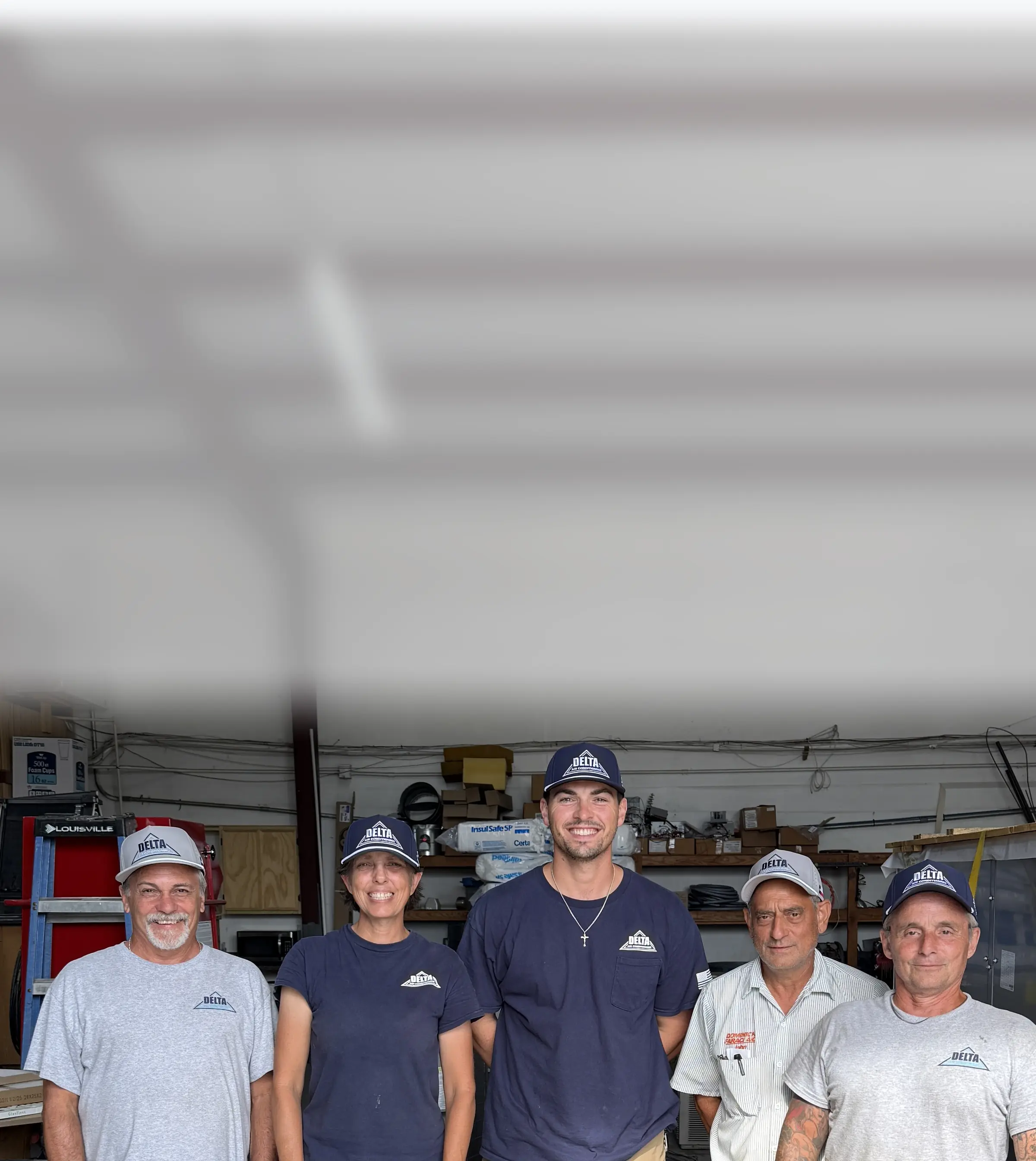 The Delta Air Conditioning crew wearing their custom embroidered Reel48 caps in the shop
