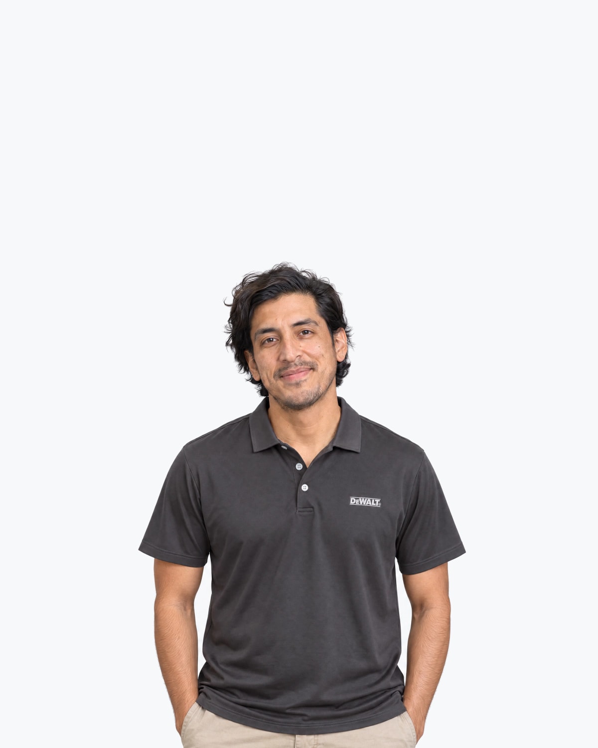 Mockup of a man in a charcoal polo with a white DeWalt logo embroidered on the chest